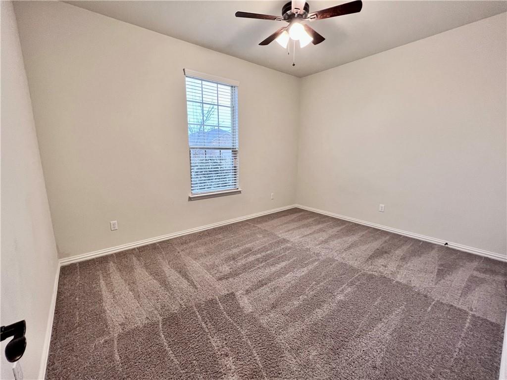 19733 Cherubini Trail Pflugerville, TX 78660 - Photo 20 of 24 Unfurnished room featuring carpet floors and a ceiling fan