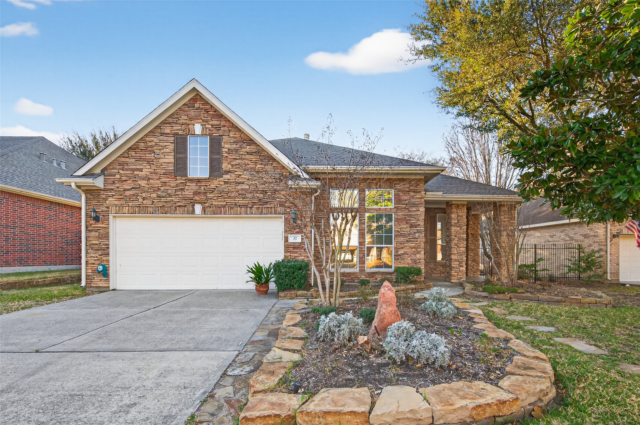 27 Sovereign Way Conroe, TX 77384 - Photo 1 of 49 Charming 1.5 Story home with a stone exterior, featuring a two-car garage and a welcoming front porch on a culdesac street! No through traffic!!