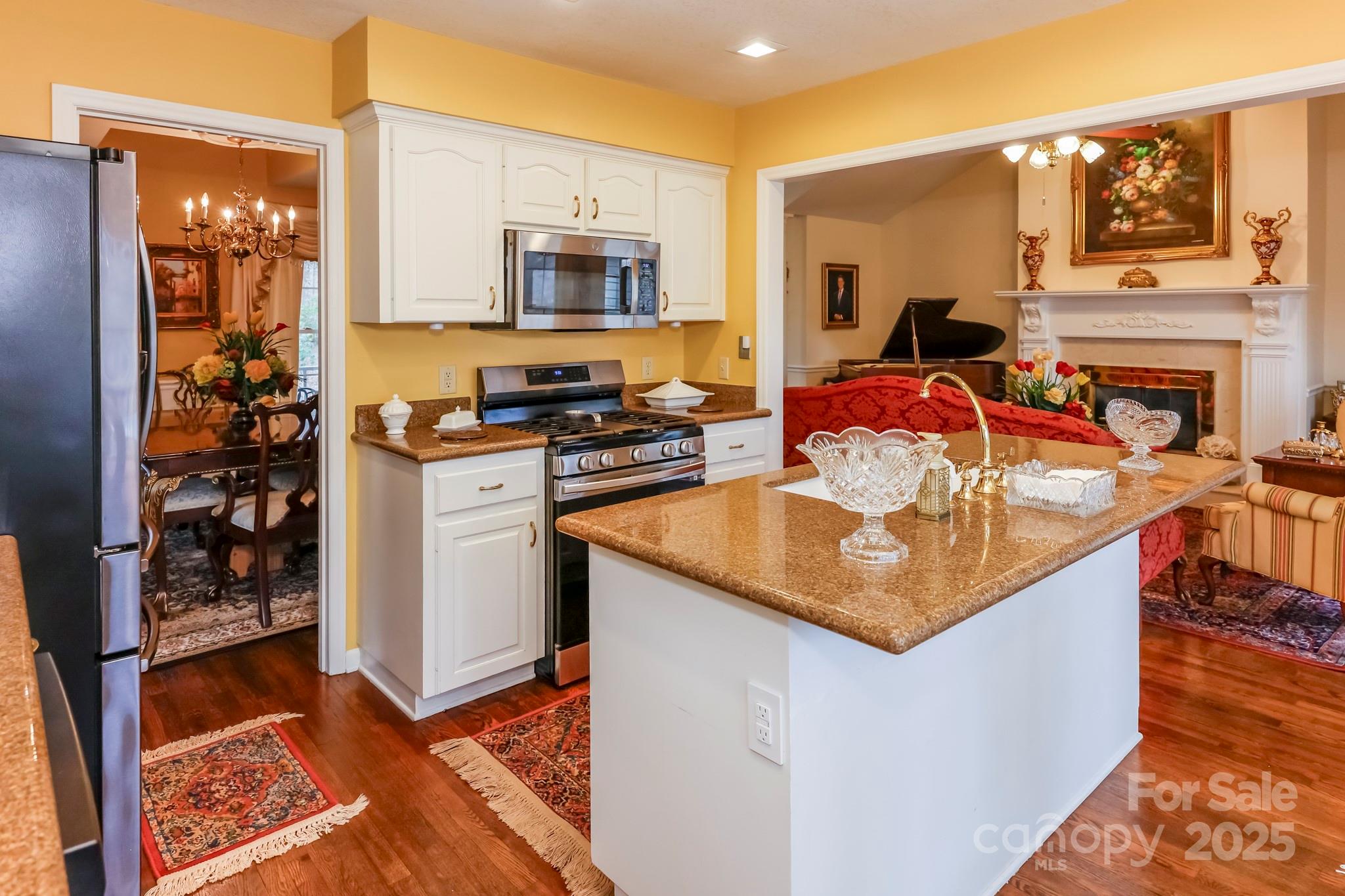 173 Sherry Street Rutherfordton, NC 28139 - Photo 17 of 33 a kitchen with a stove a sink and a refrigerator