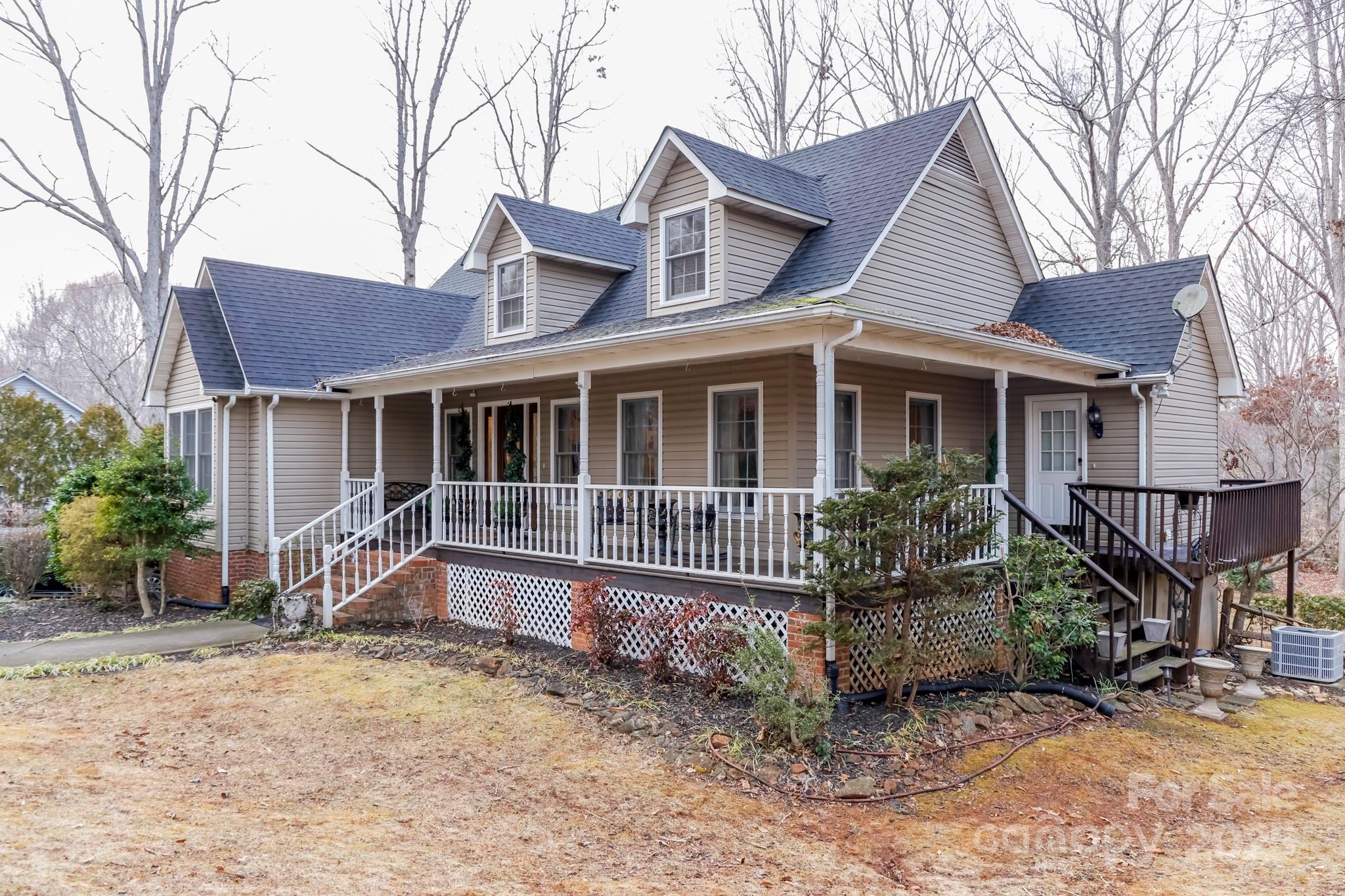 173 Sherry Street Rutherfordton, NC 28139 - Photo 2 of 33 a house that has a large tree in front of it