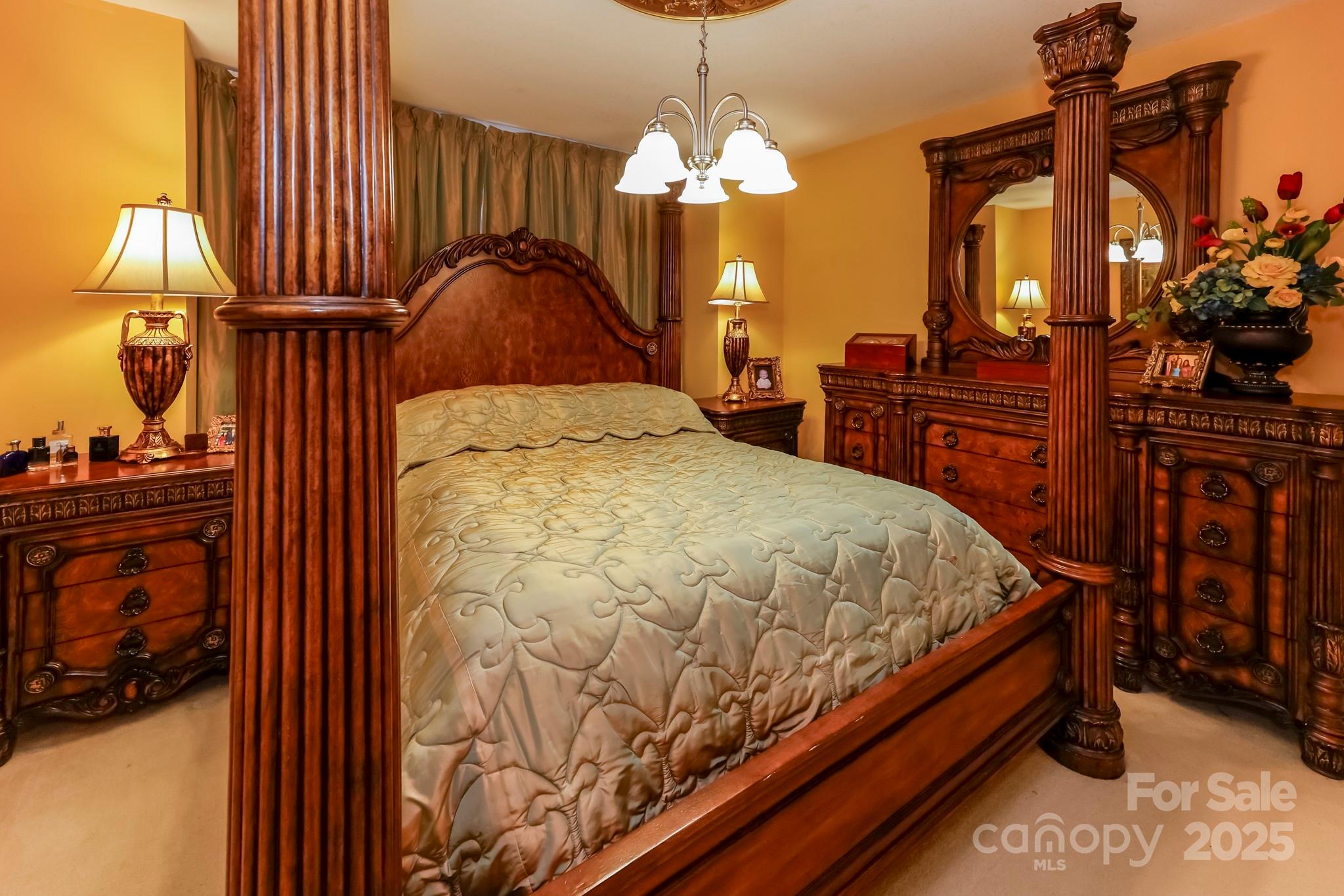 173 Sherry Street Rutherfordton, NC 28139 - Photo 28 of 33 a bed room with a bed and a chandelier