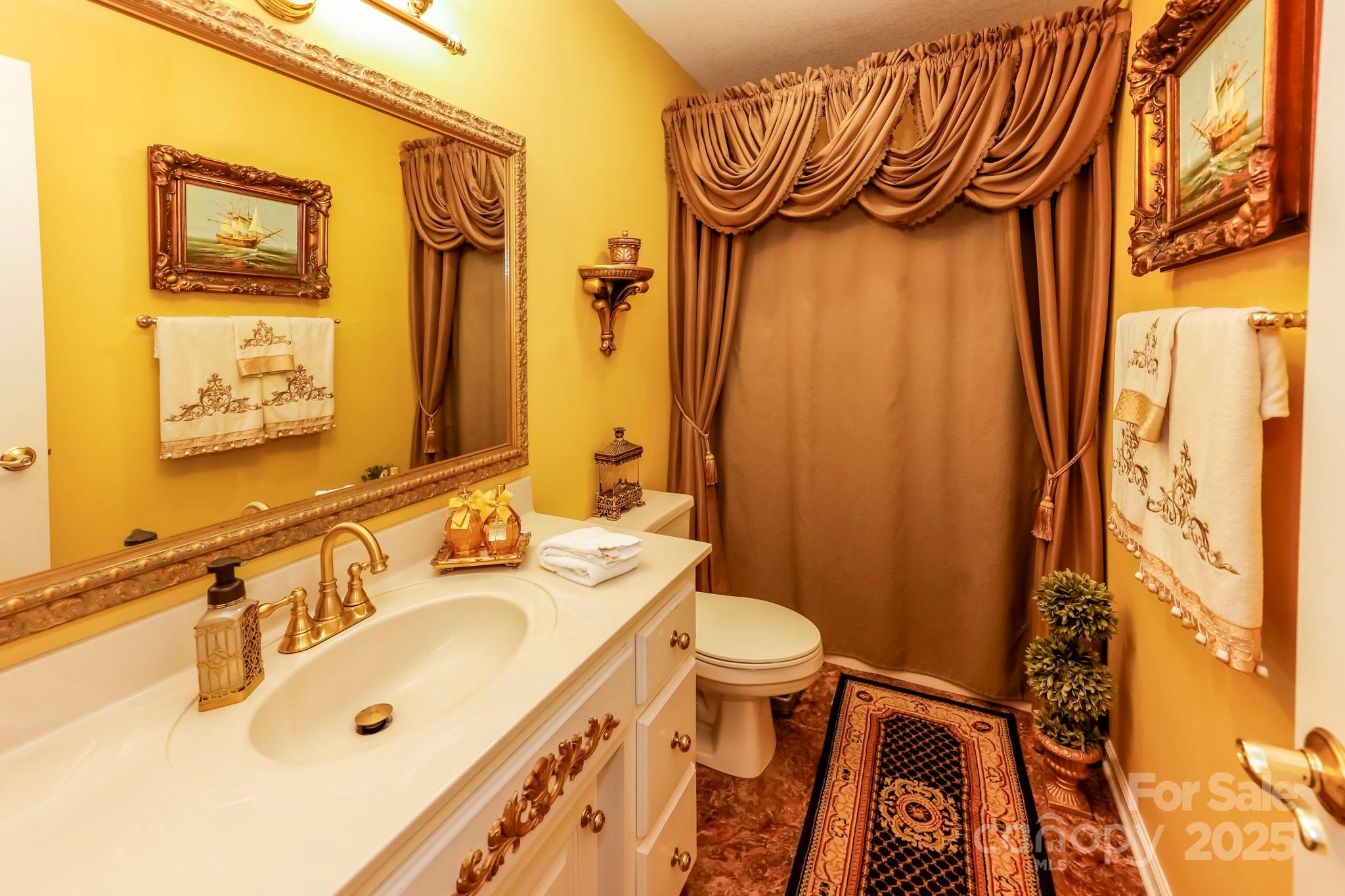 173 Sherry Street Rutherfordton, NC 28139 - Photo 30 of 33 a bathroom with a sink and a mirror