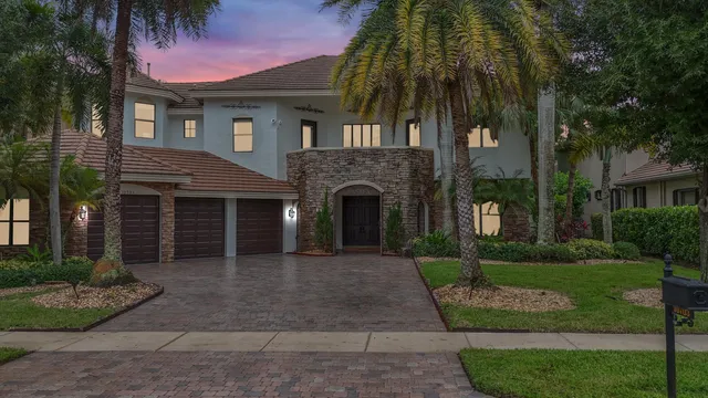 a kitchen with kitchen island granite countertop stainless steel appliances and cabinets