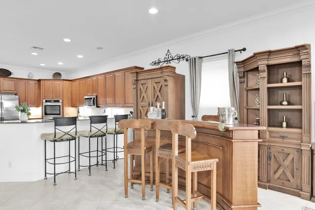 $10,000 | 10703 Versailles Boulevard, Wellington, FL 33449