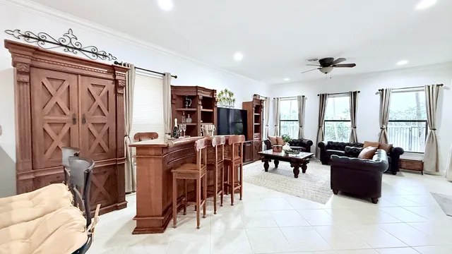 $10,000 | 10703 Versailles Boulevard, Wellington, FL 33449