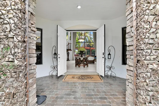 a kitchen with kitchen island granite countertop wooden cabinets a sink and dishwasher