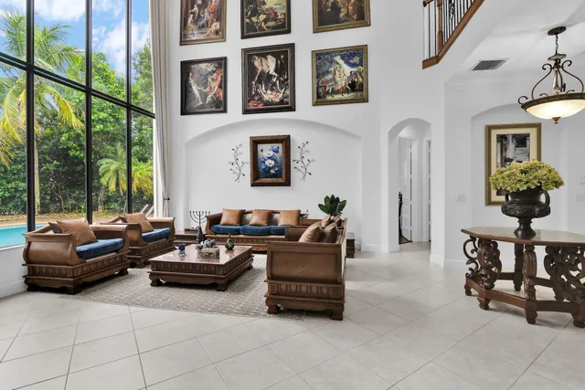 a dining room with furniture window and outside view