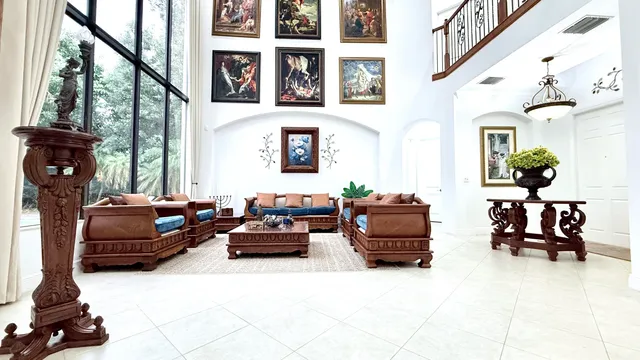 a kitchen with stainless steel appliances kitchen island granite countertop a refrigerator and cabinets