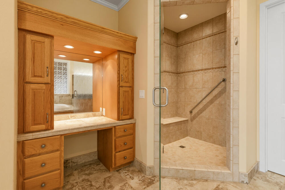 6586 Cooper's Hawk Road Klamath Falls, OR 97601 - Photo 25 of 68 a bathroom with a double vanity sink mirror and shower