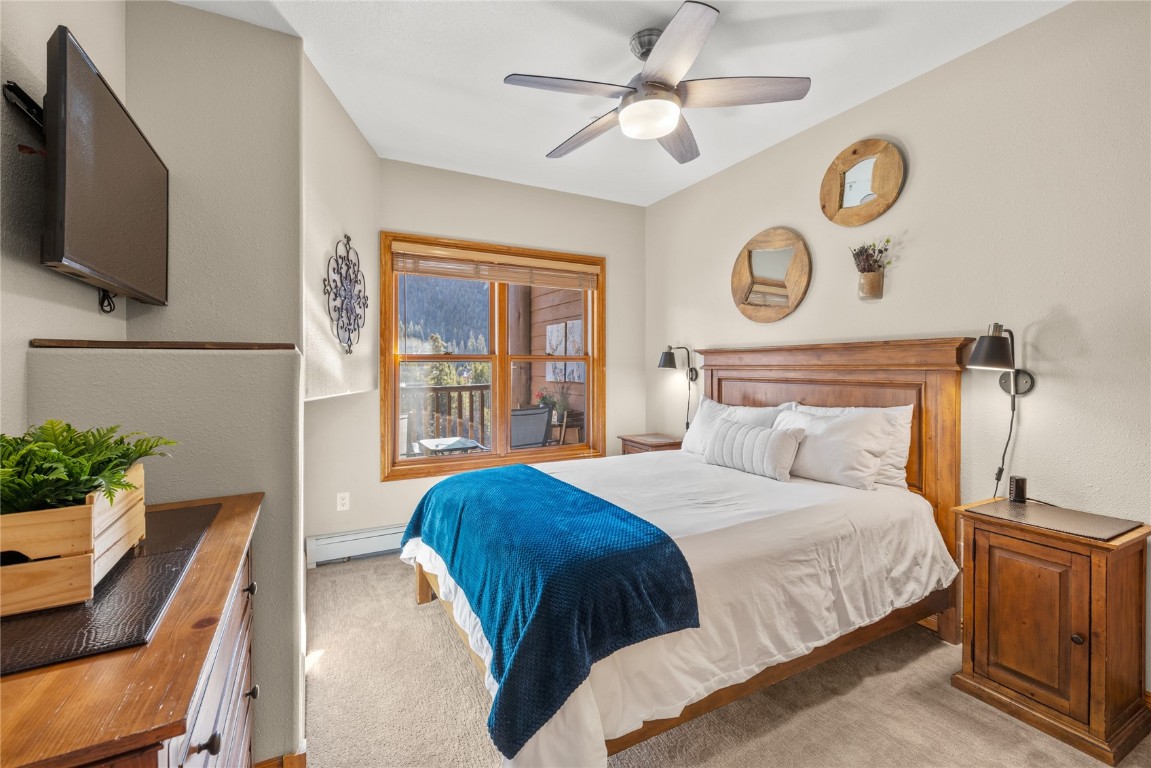 22714 Highway 6, Unit 5989 Keystone, CO 80435 - Photo 16 of 37 a bedroom with a bed and a television