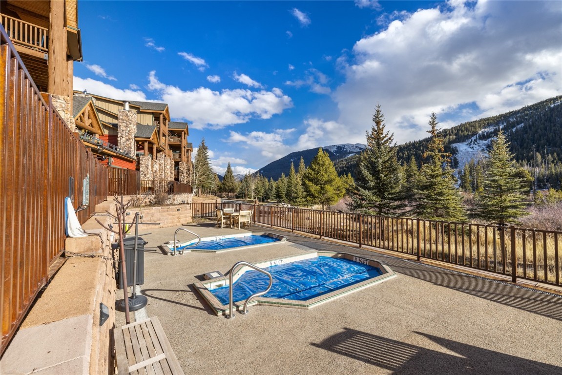 22714 Highway 6, Unit 5989 Keystone, CO 80435 - Photo 21 of 37 a view of a patio with swimming pool and sitting area
