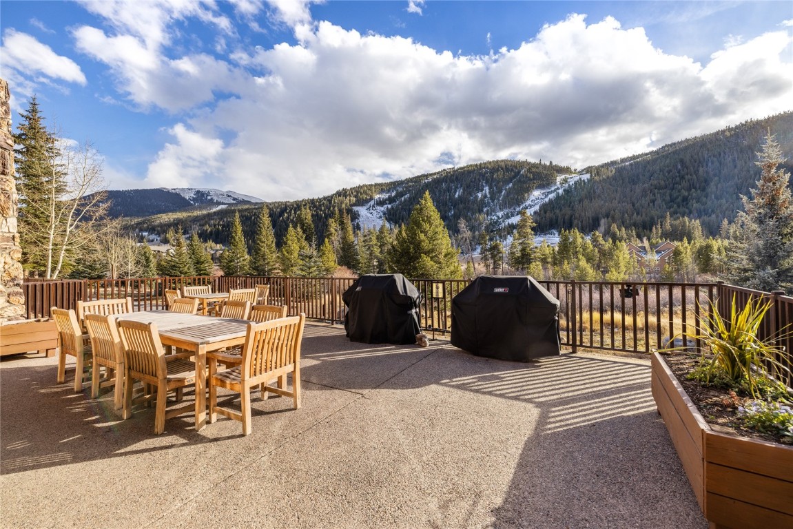 22714 Highway 6, Unit 5989 Keystone, CO 80435 - Photo 24 of 37 a view of a patio with table and chairs