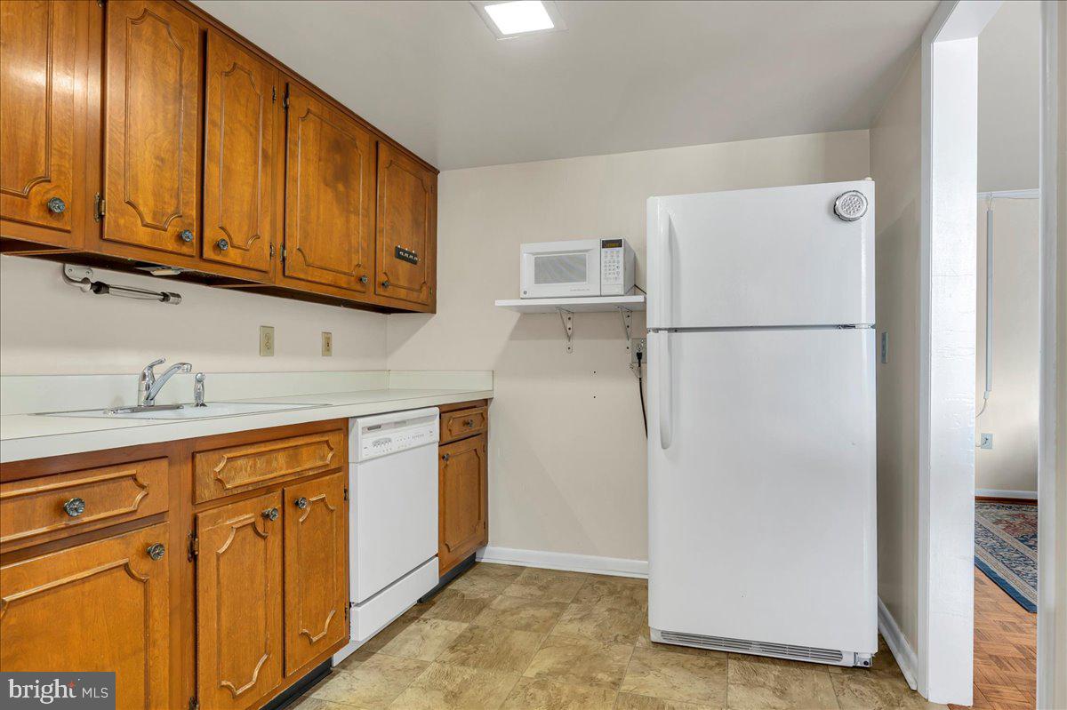 1403 Shallcross Avenue, Unit 310 Wilmington, DE 19806 - Photo 12 of 21 a view of a kitchen with electric appliances
