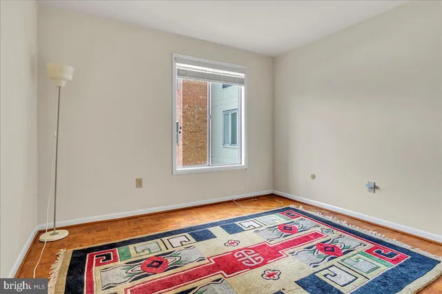 a area with a bed and a window