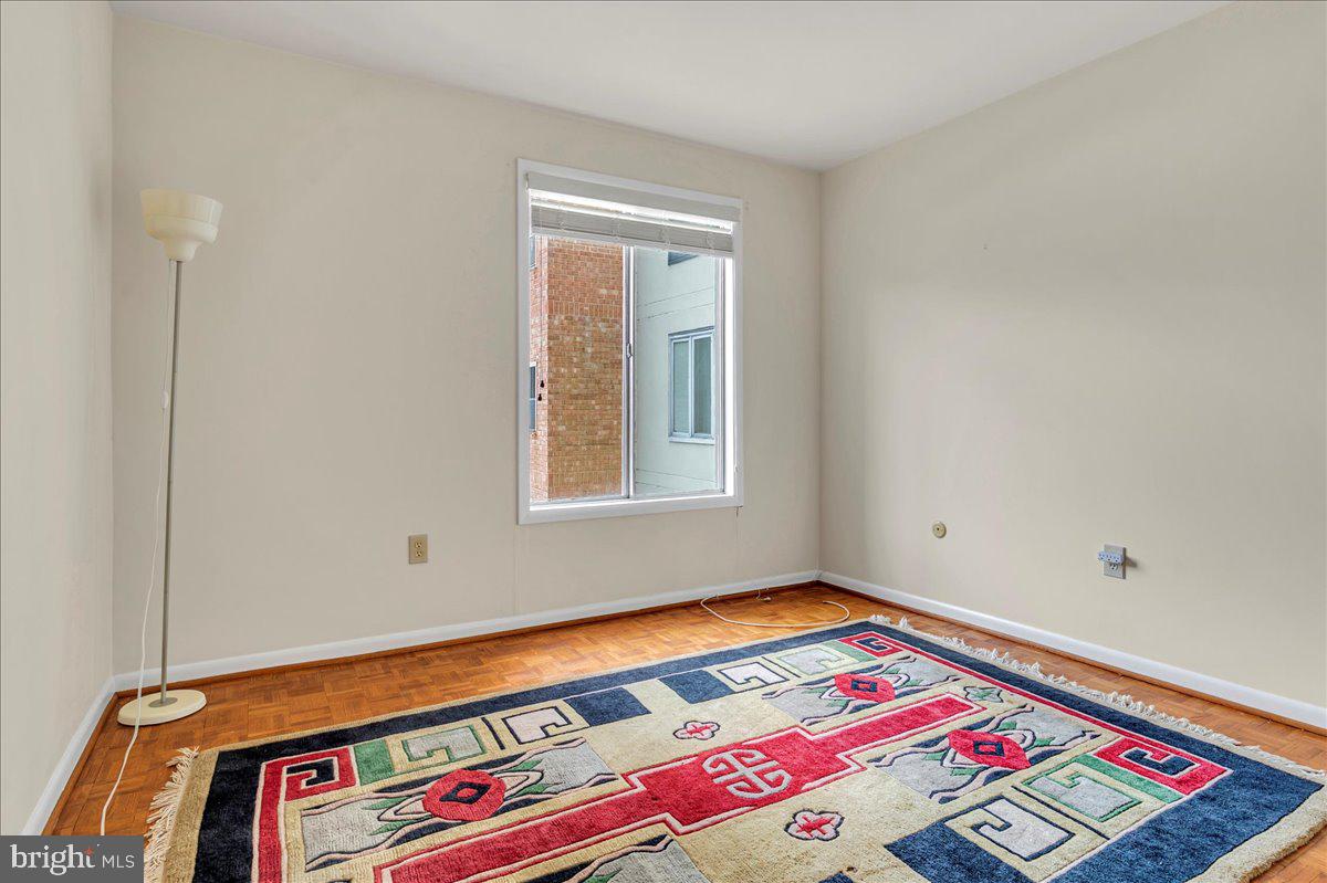 1403 Shallcross Avenue, Unit 310 Wilmington, DE 19806 - Photo 14 of 21 a area with a bed and a window