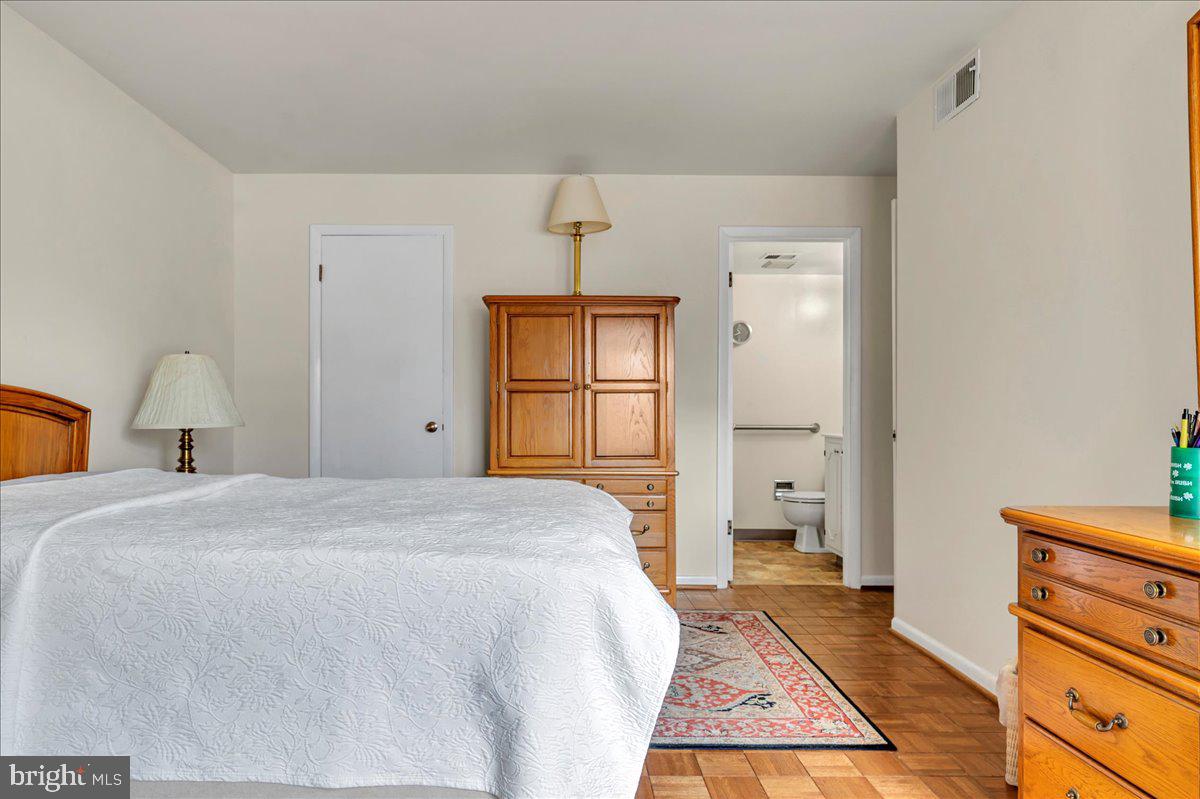 1403 Shallcross Avenue, Unit 310 Wilmington, DE 19806 - Photo 17 of 21 a bedroom with a bed and window