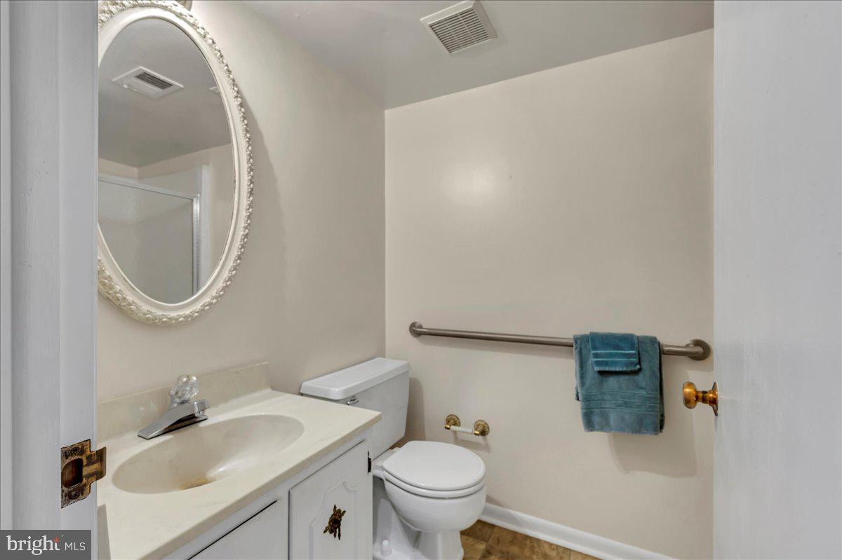 1403 Shallcross Avenue, Unit 310 Wilmington, DE 19806 - Photo 18 of 21 a bathroom with a sink and a mirror