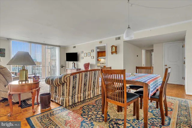 a view of a livingroom with furniture and a flat screen tv