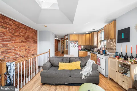 a living room with furniture fireplace and flat screen tv