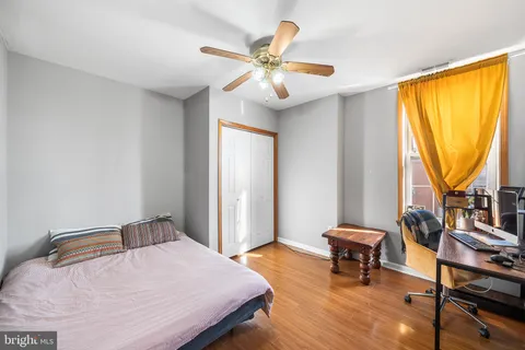 a bedroom with furniture and a window