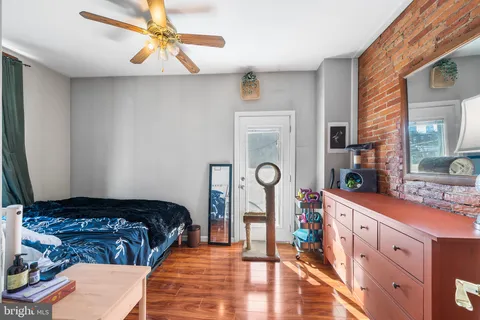 a bedroom with bed and window