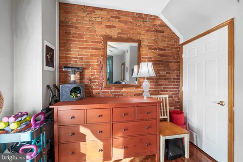a bathroom with a sink mirror and vanity