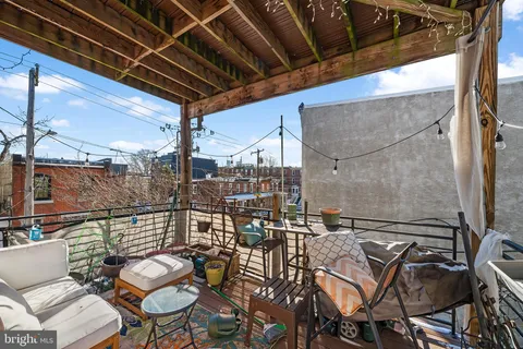 a view of a chairs and table in the patio