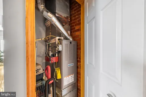a view of walk in closet with clothes