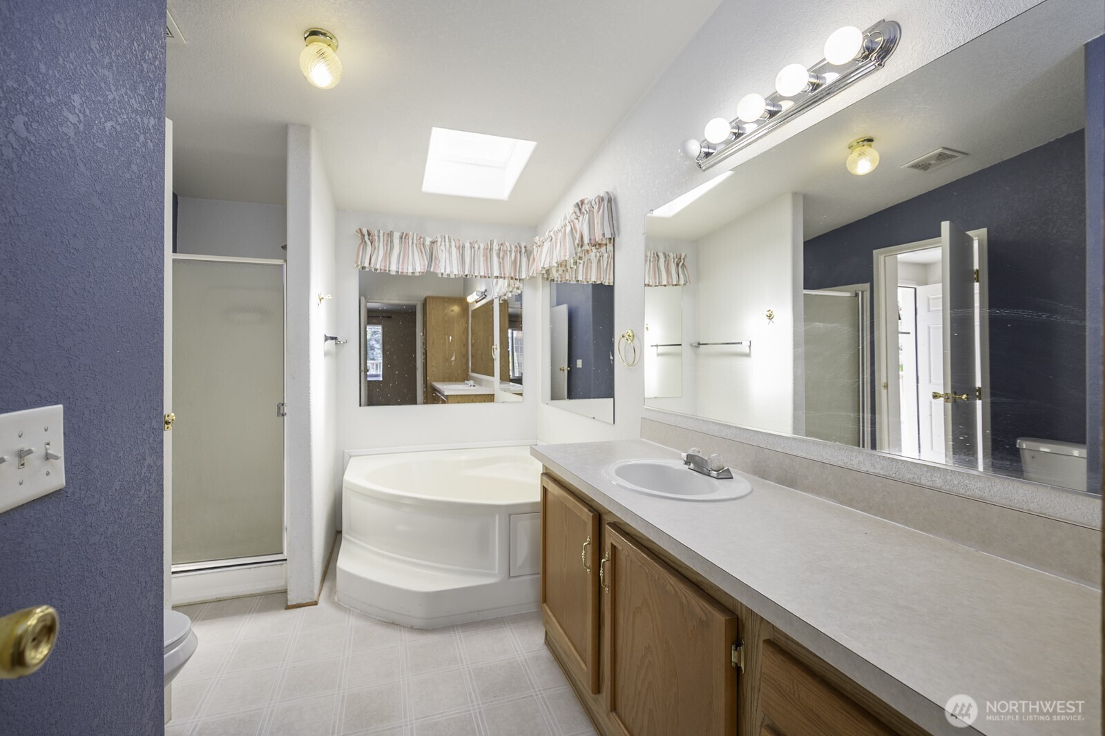 10035 Fordair Road Northeast Coulee City, WA 99115 - Photo 16 of 27 a bathroom with a sink a faucet a lamp and a mirror