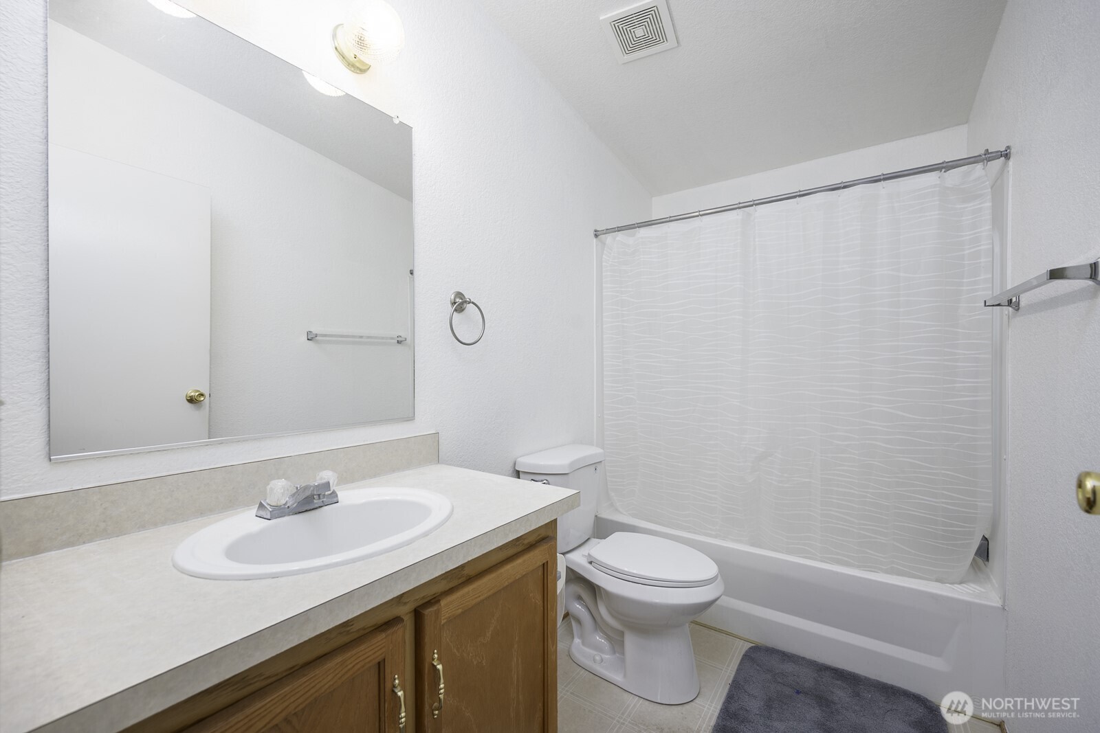 10035 Fordair Road Northeast Coulee City, WA 99115 - Photo 19 of 27 a bathroom with a sink a toilet and shower