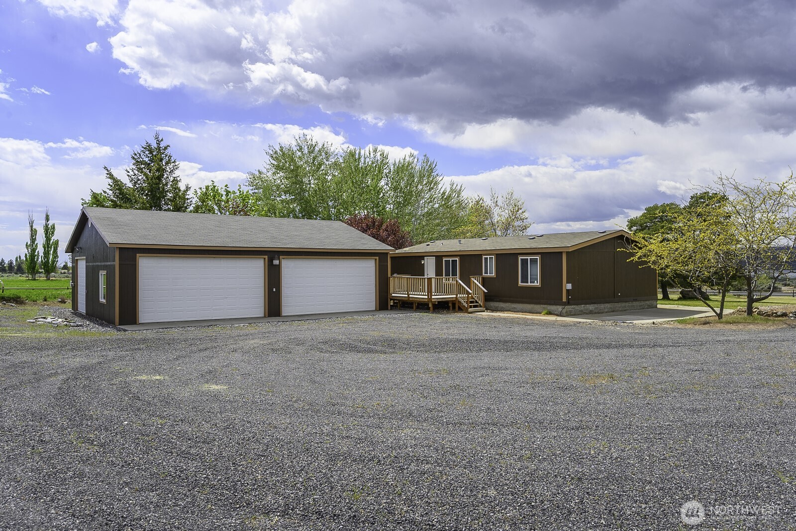 10035 Fordair Road Northeast Coulee City, WA 99115 - Photo 4 of 27 a front view of a house with a yard and garage