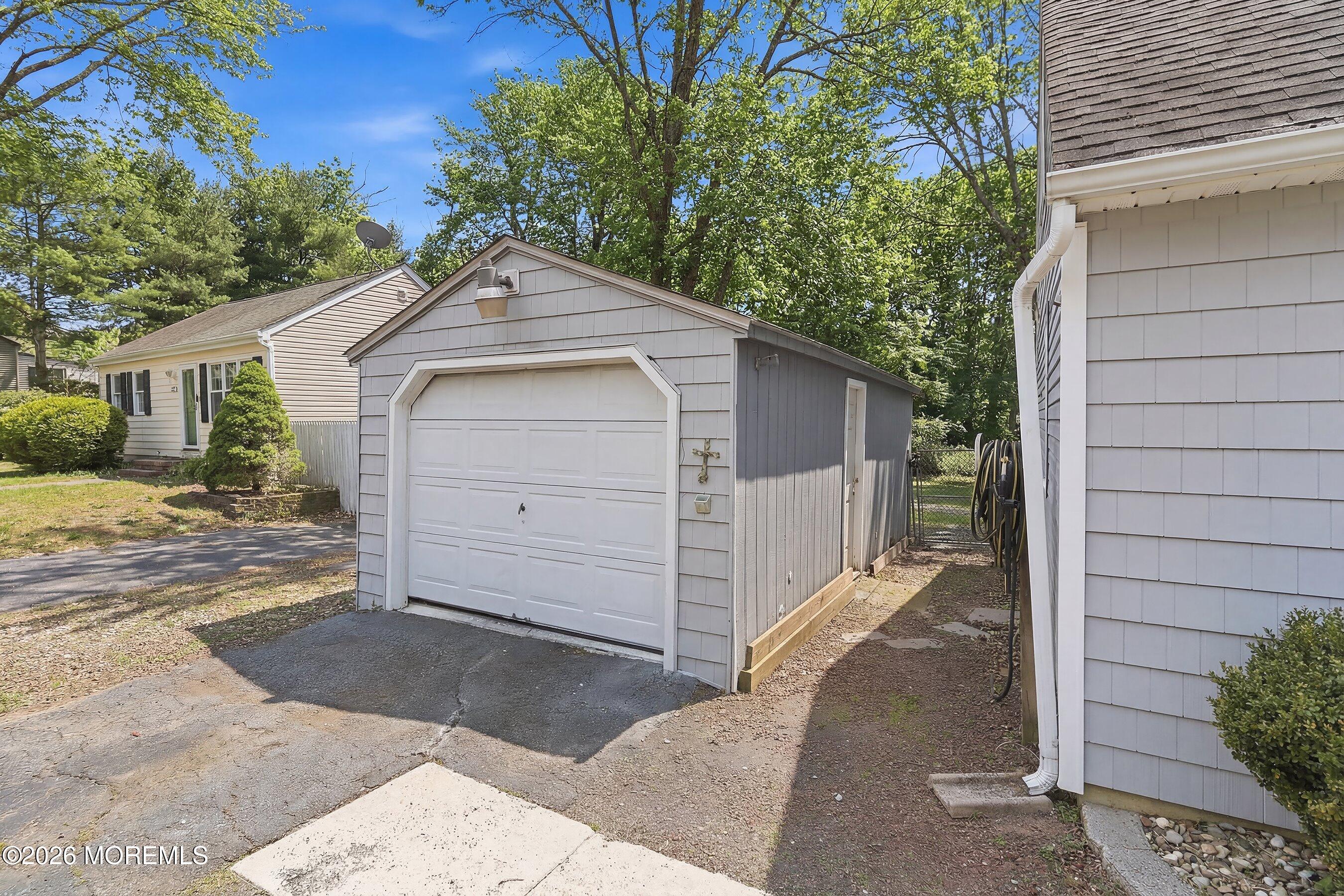 219 Stuart Street Howell, NJ 07731 - Photo 2 of 36 a front view of a house with a garage