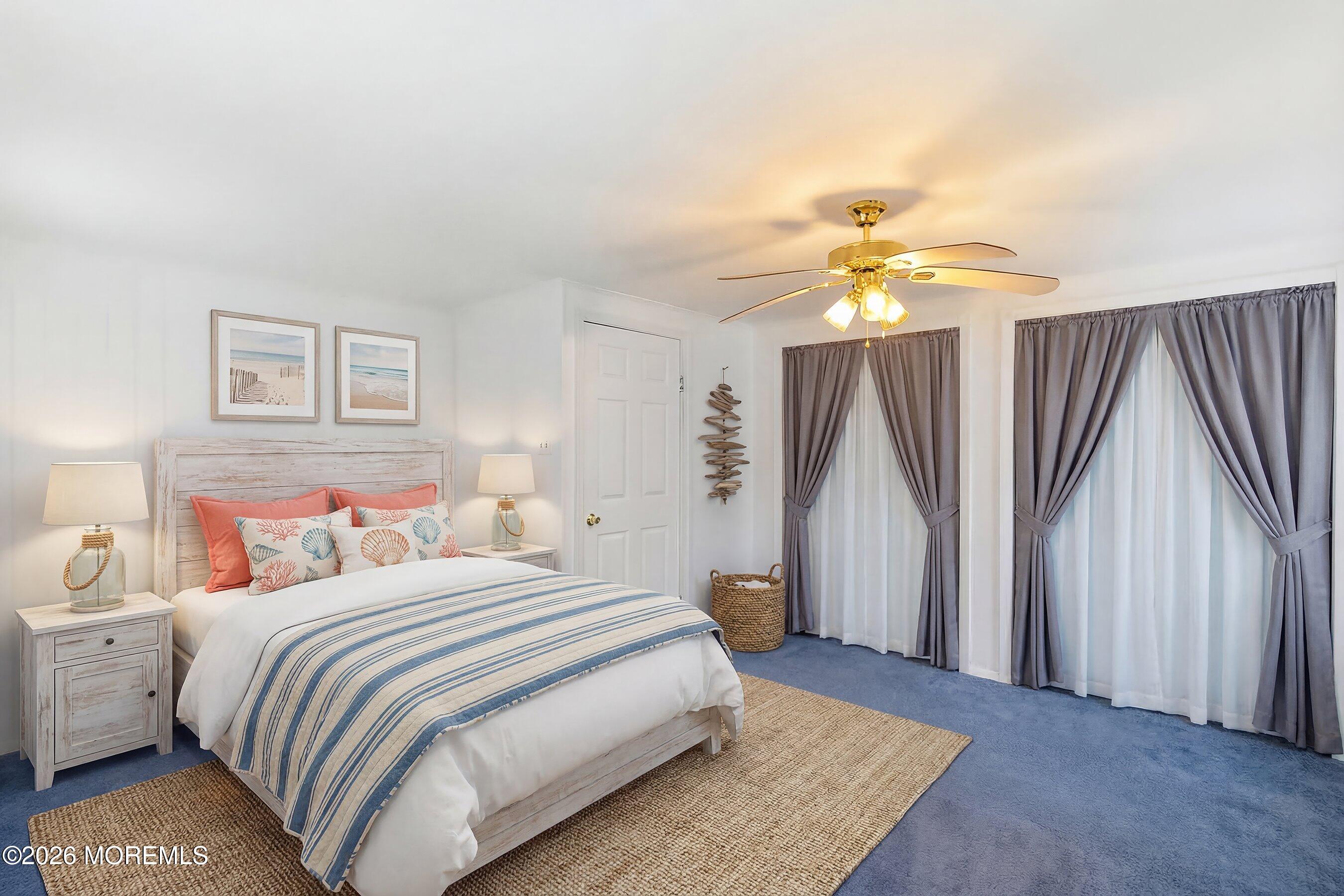 219 Stuart Street Howell, NJ 07731 - Photo 21 of 36 a bedroom with a bed and a chandelier