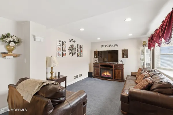 a bath room with a sink and a window