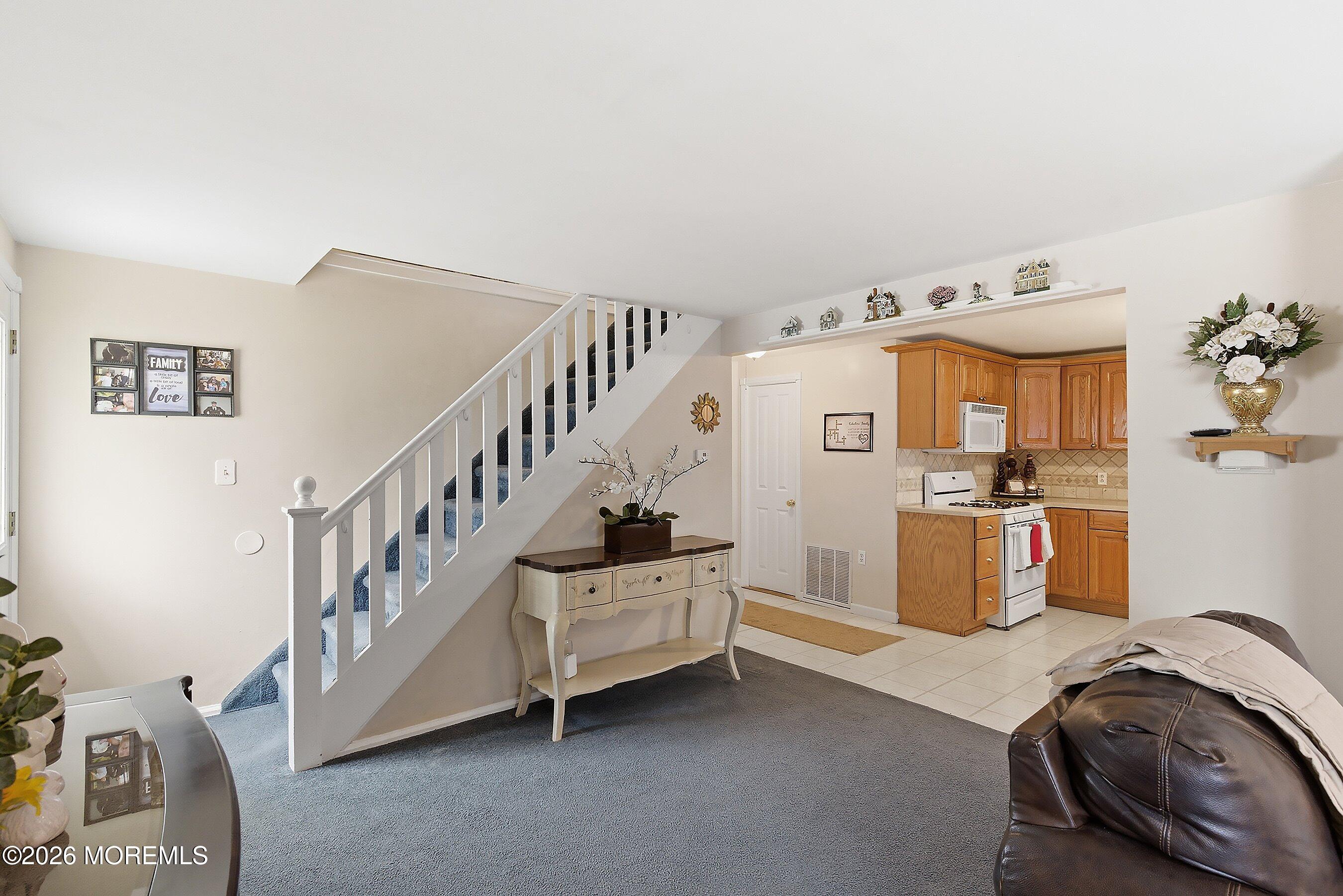 219 Stuart Street Howell, NJ 07731 - Photo 7 of 36 12-Living Foyer and Kitchen