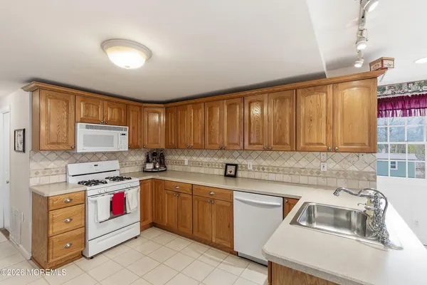 a bedroom with a bed dresser and a window