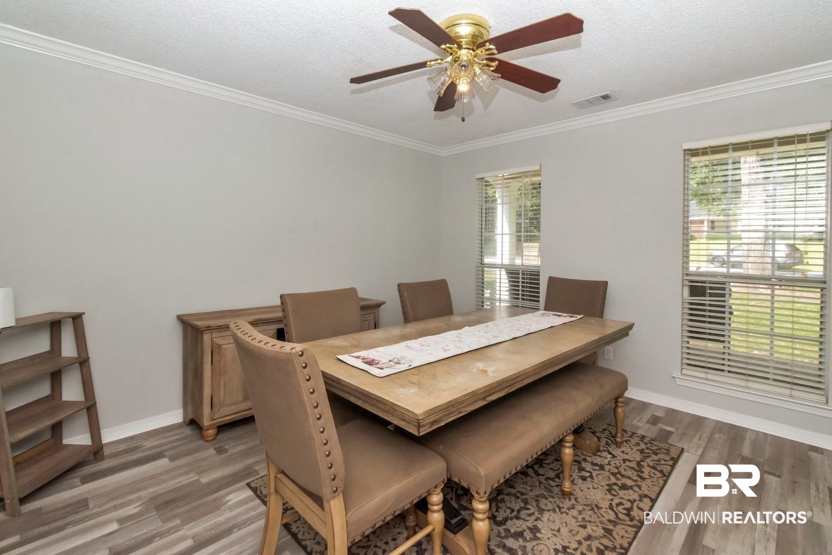 9991 Wedgefield Court Mobile, AL 36608 - Photo 12 of 30 Dining space with a textured ceiling, ceiling fan, hardwood / wood-style floors, and crown molding