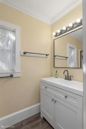 a bathroom with a glass shower door