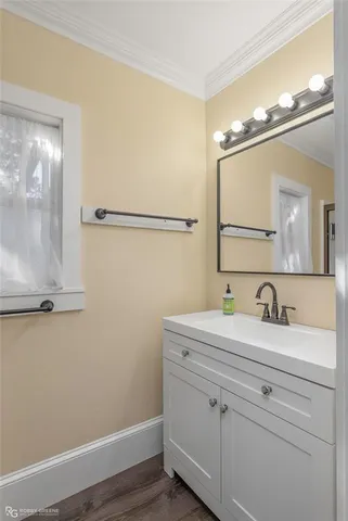 a bathroom with a glass shower door