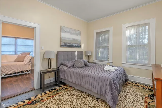 a bed room with a bed and a chair