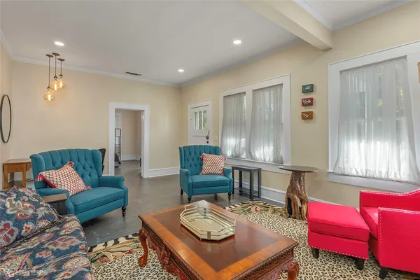 a living room with furniture and a window