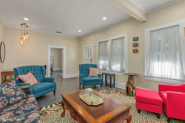 a living room with furniture and a window