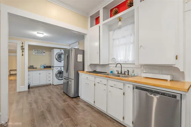 a utility room with wooden floor
