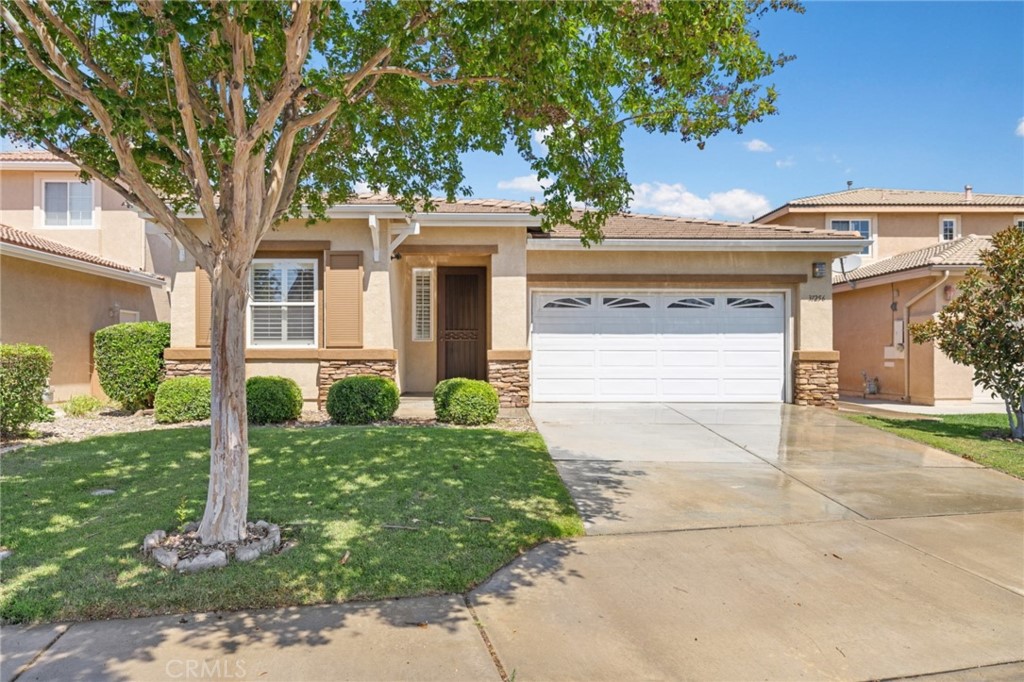 31256 Firestone Street Temecula, CA 92591 - Photo 11 of 56 a front view of a house with garden