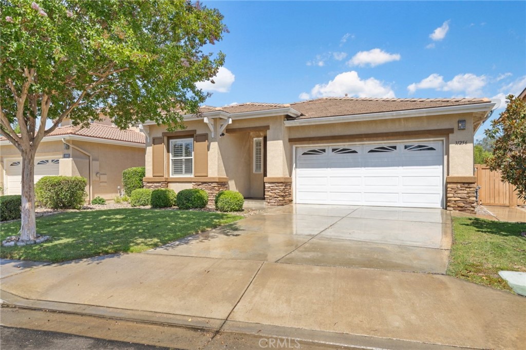 31256 Firestone Street Temecula, CA 92591 - Photo 12 of 56 a view of a house with a yard