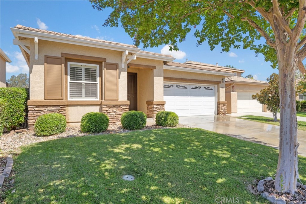 31256 Firestone Street Temecula, CA 92591 - Photo 13 of 56 a front view of a house with garden