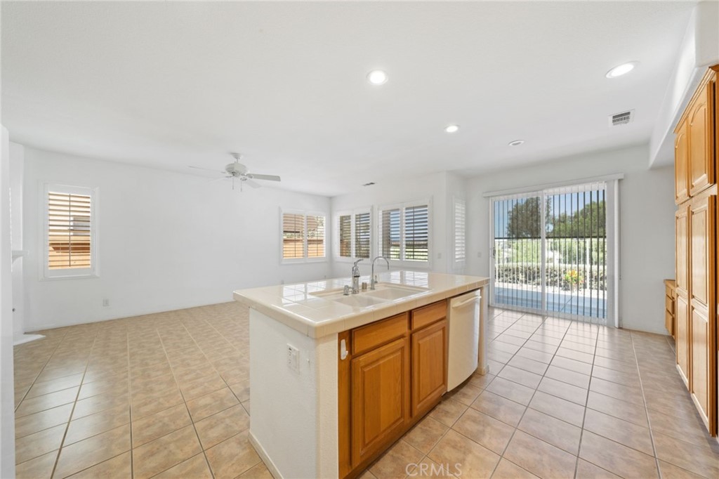 31256 Firestone Street Temecula, CA 92591 - Photo 20 of 56 a kitchen with a sink a counter top space and appliances