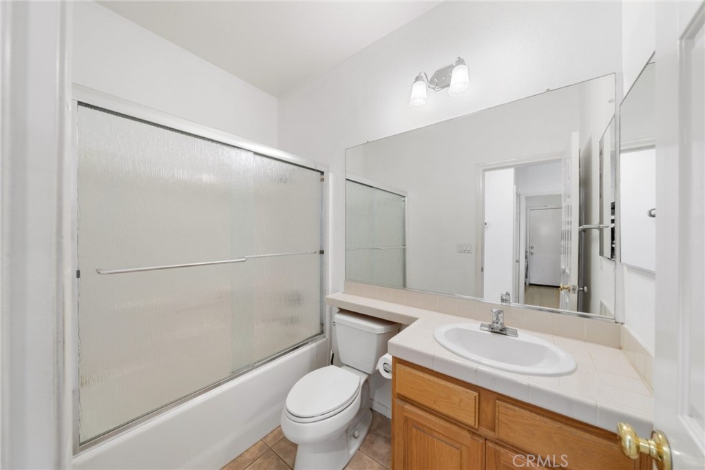 31256 Firestone Street Temecula, CA 92591 - Photo 23 of 56 a bathroom with a sink toilet and shower