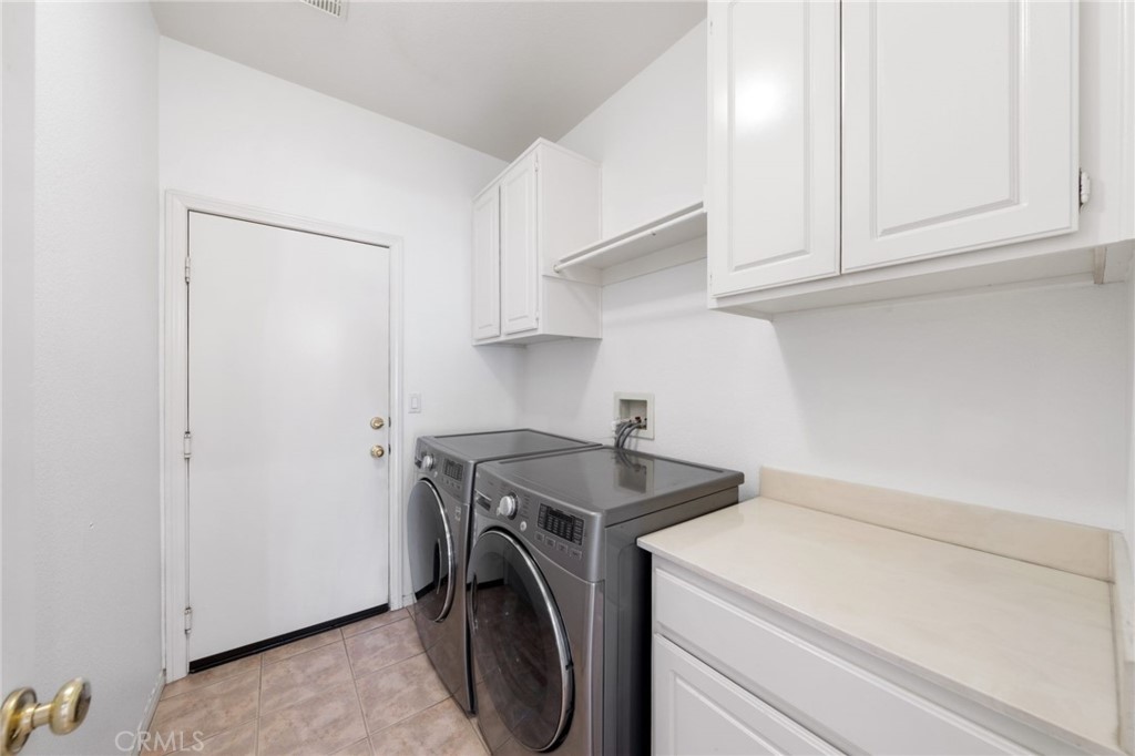 31256 Firestone Street Temecula, CA 92591 - Photo 24 of 56 a utility room with dryer and washer