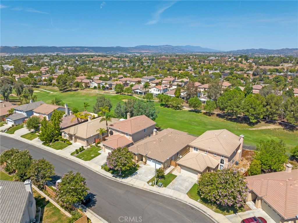 31256 Firestone Street Temecula, CA 92591 - Photo 42 of 56 an aerial view of a city with lots of residential buildings ocean and mountain view in back